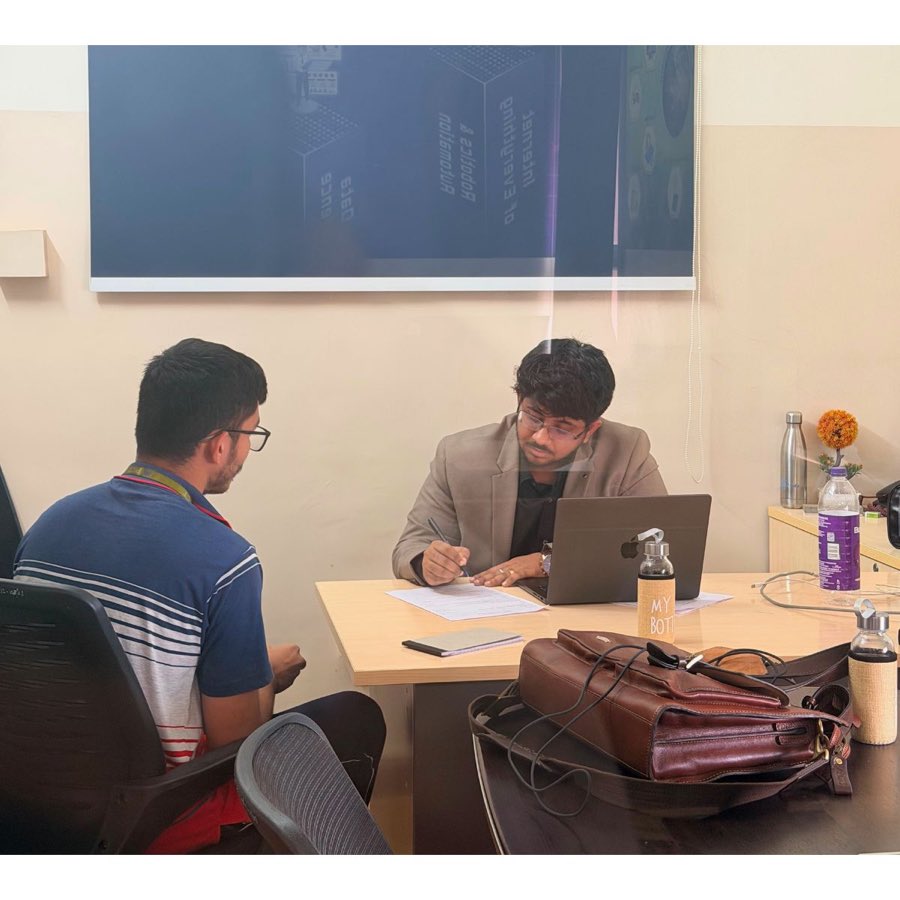 Vivek Gupta speaking with a student during a mentoring session